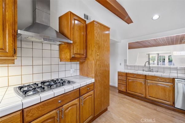 Interior, Kitchen, Recessed Lighting, Stainless Steel Appliances, Tile Countertops, Wood Texture Flooring