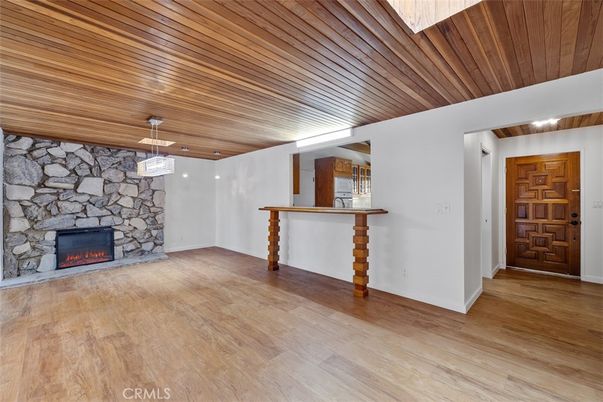 Empty room, Fireplace, Interior, Pendant Lights, Stone Walls, Wooden Ceilings, Wood Texture Flooring