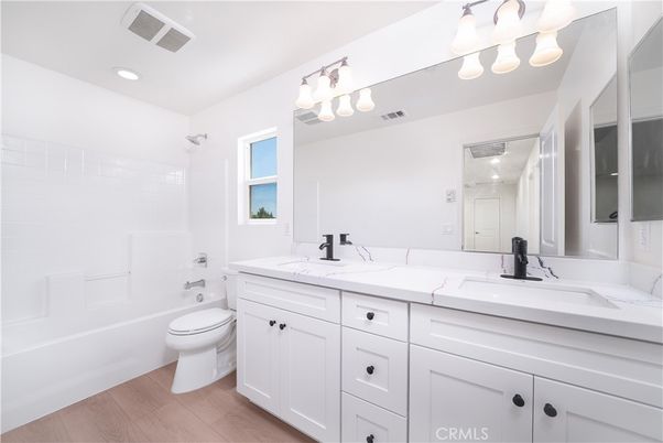 Bathroom, Dual Sink Vanities, Interior, Recessed Lighting, Wood Texture Flooring