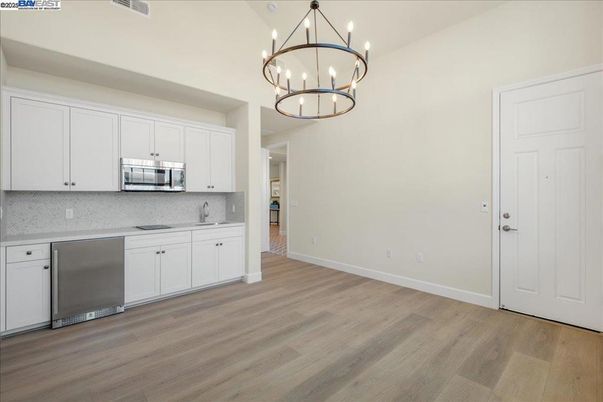 Chandelier, Interior, Kitchen, Pendant Lights, Stainless Steel Appliances, Wood Texture Flooring