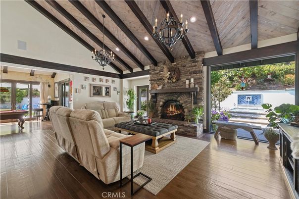 Billiard Table, Chandelier, Fireplace, Interior, Living room, Piano, Recessed Lighting, Stone Walls, Wooden Beams, Wooden Ceilings, Wood Texture Flooring