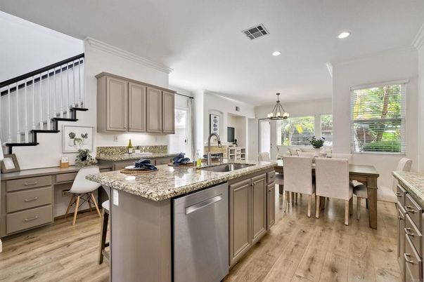 Chandelier, Dining room, Interior, Kitchen, Pendant Lights, Recessed Lighting, Stainless Steel Appliances, Wood Texture Flooring