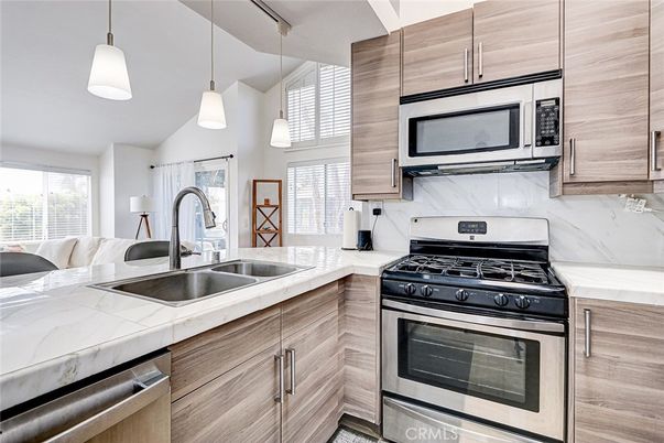 Interior, Kitchen, Pendant Lights, Stainless Steel Appliances, Tile Countertops, Wood Texture Flooring