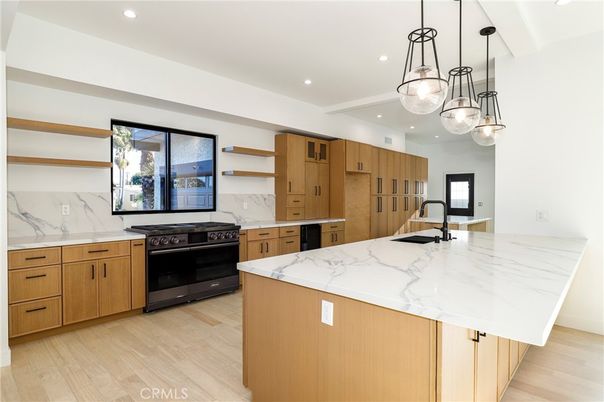 Interior, Kitchen, Marble Walls, Pendant Lights, Recessed Lighting, Stainless Steel Appliances, Wood Texture Flooring