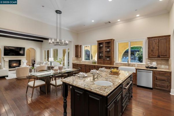Chandelier, Dining room, Interior, Kitchen, Pendant Lights, Recessed Lighting, Stainless Steel Appliances, Wood Texture Flooring