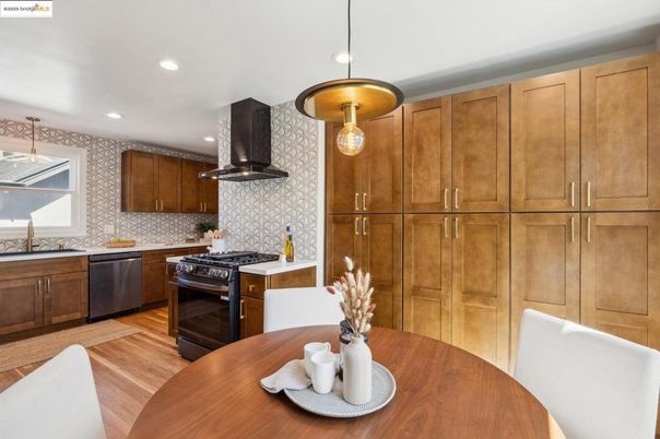 Dining room, Interior, Kitchen, Pendant Lights, Recessed Lighting, Stainless Steel Appliances, Wood Texture Flooring
