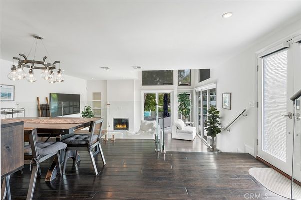 Dining room, Fireplace, Interior, Living room, Pendant Lights, Recessed Lighting, Wood Texture Flooring