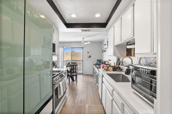 Dining room, Interior, Kitchen, Recessed Lighting, Stainless Steel Appliances, Wood Texture Flooring