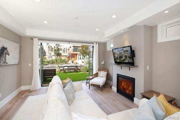 Dining room, Fireplace, Interior, Living room, Recessed Lighting, Wood Texture Flooring