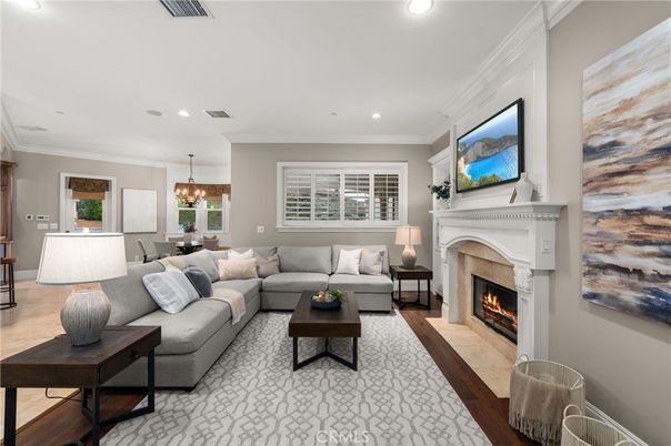 Chandelier, Dining room, Fireplace, Interior, Living room, Pendant Lights, Recessed Lighting, Wood Texture Flooring