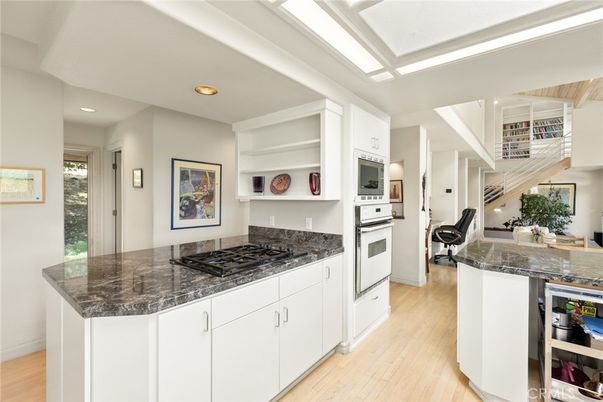 Fitness Equipment, Interior, Kitchen, Recessed Lighting, Stainless Steel Appliances, Wood Texture Flooring