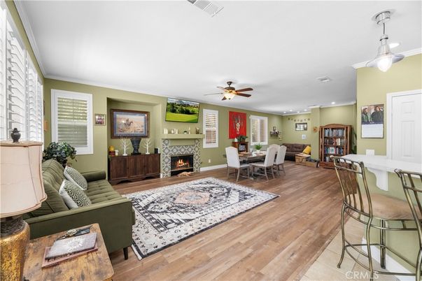 Dining room, Fireplace, Interior, Living room, Recessed Lighting, Wood Texture Flooring