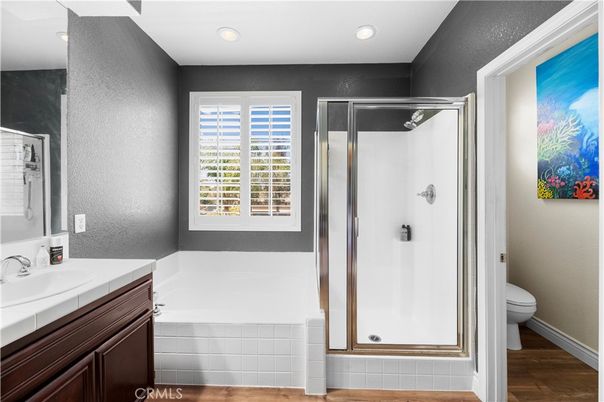 Bathroom, Glass Shower, Interior, Recessed Lighting, Tile Countertops, Wood Texture Flooring