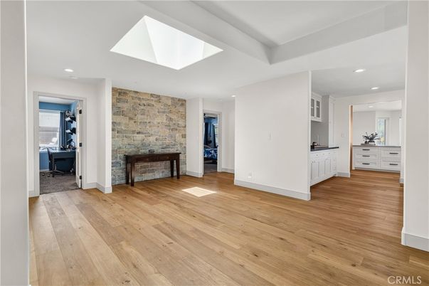 Empty room, Fireplace, Interior, Recessed Lighting, Stone Walls, Wood Texture Flooring