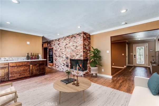 Fireplace, Interior, Living room, Recessed Lighting, Stone Walls, Wood Texture Flooring