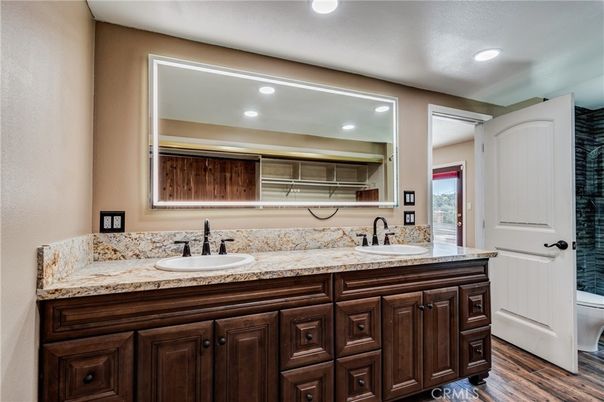 Bathroom, Dual Sink Vanities, Interior, Recessed Lighting, Wood Texture Flooring