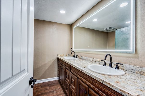 Bathroom, Dual Sink Vanities, Interior, Recessed Lighting, Wood Texture Flooring