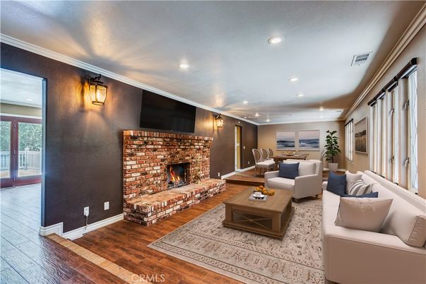 Dining room, Fireplace, Interior, Living room, Recessed Lighting, Wood Texture Flooring