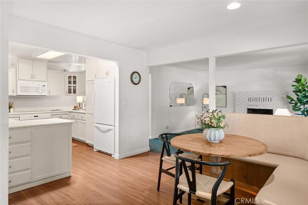 Dining room, Fireplace, Interior, Kitchen, Recessed Lighting, Wood Texture Flooring