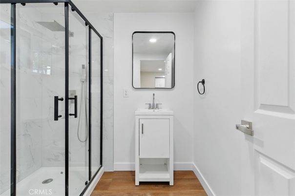 Bathroom, Glass Shower, Interior, Marble Walls, Recessed Lighting, Wood Texture Flooring