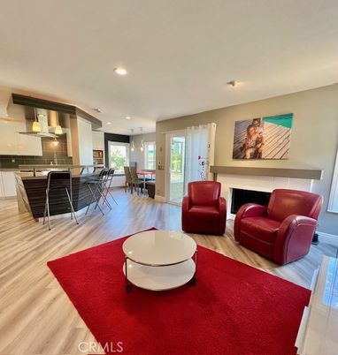 Dining room, Fireplace, Interior, Kitchen, Living room, Pendant Lights, Recessed Lighting, Stainless Steel Appliances, Wood Texture Flooring
