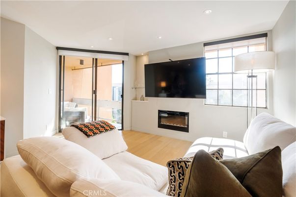 Bedroom, Fireplace, Interior, Living room, Recessed Lighting, Wood Texture Flooring