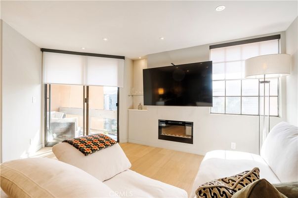 Bedroom, Fireplace, Interior, Living room, Recessed Lighting, Wood Texture Flooring