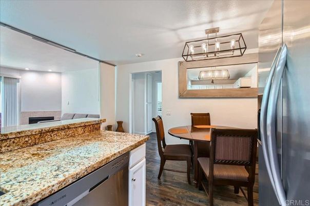 Dining room, Fireplace, Interior, Kitchen, Recessed Lighting, Stainless Steel Appliances, Wood Texture Flooring