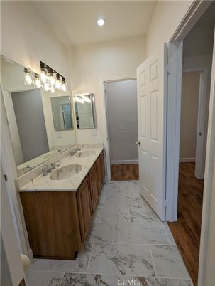 Bathroom, Dual Sink Vanities, Interior, Marble, Recessed Lighting, Wood Texture Flooring