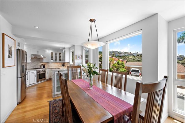 Dining room, Interior, Kitchen, Pendant Lights, Recessed Lighting, Stainless Steel Appliances, Wood Texture Flooring