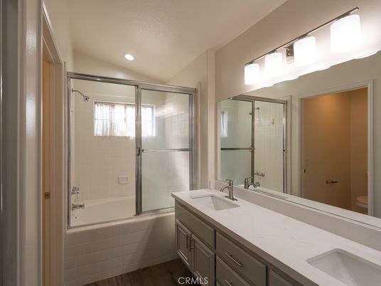 Bathroom, Dual Sink Vanities, Glass Shower, Interior, Recessed Lighting, Wood Texture Flooring