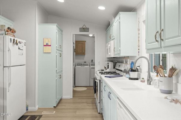 Interior, Kitchen, Recessed Lighting, Washer, Wood Texture Flooring