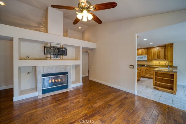Empty room, Fireplace, Interior, Kitchen, Recessed Lighting, Wood Texture Flooring