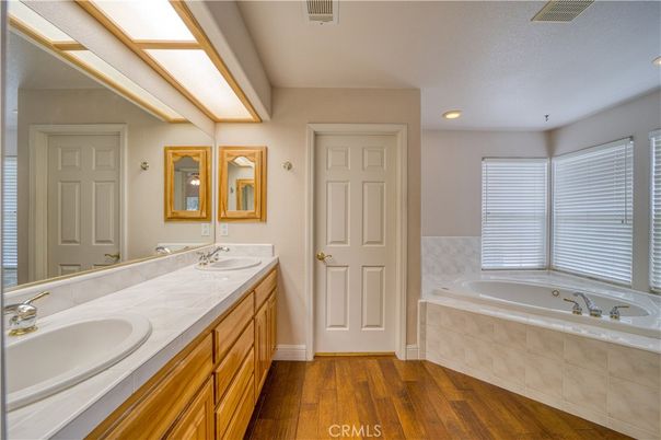 Bathroom, Dual Sink Vanities, Interior, Recessed Lighting, Tile Countertops, Wood Texture Flooring