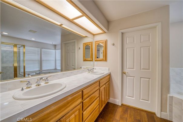 Bathroom, Dual Sink Vanities, Interior, Recessed Lighting, Tile Countertops, Wood Texture Flooring