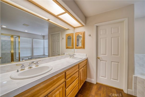 Bathroom, Dual Sink Vanities, Interior, Recessed Lighting, Tile Countertops, Wood Texture Flooring