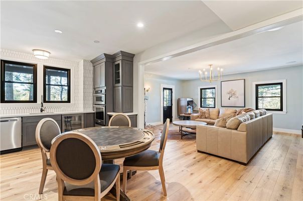 Chandelier, Dining room, Interior, Kitchen, Living room, Recessed Lighting, Stainless Steel Appliances, Wood Texture Flooring