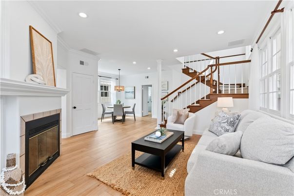 Chandelier, Dining room, Fireplace, Interior, Living room, Pendant Lights, Recessed Lighting, Wood Texture Flooring