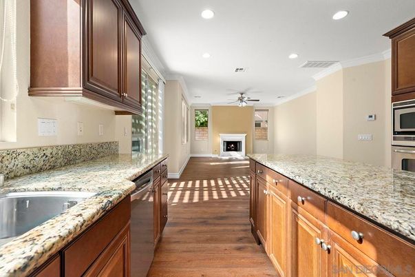 Fireplace, Interior, Kitchen, Recessed Lighting, Stainless Steel Appliances, Wood Texture Flooring