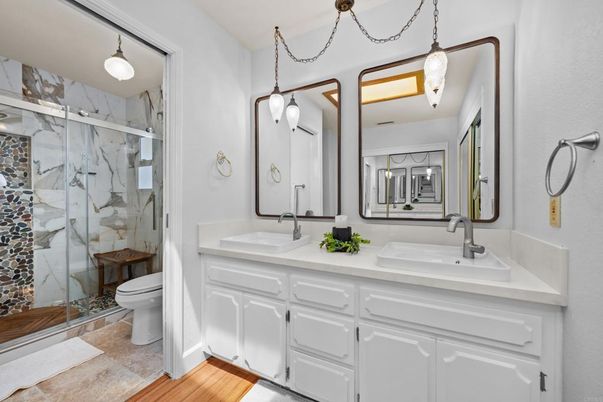 Bathroom, Dual Sink Vanities, Glass Shower, Interior, Marble Walls, Pendant Lights