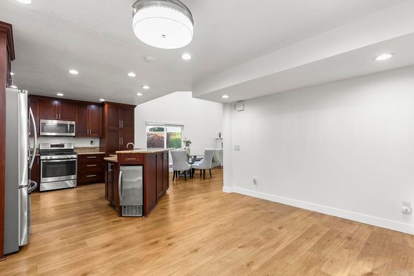 Dining room, Interior, Kitchen, Recessed Lighting, Stainless Steel Appliances, Wood Texture Flooring