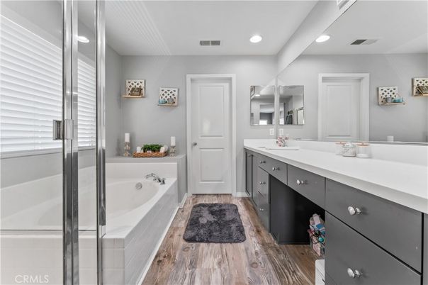 Bathroom, Dual Sink Vanities, Interior, Recessed Lighting, Wood Texture Flooring