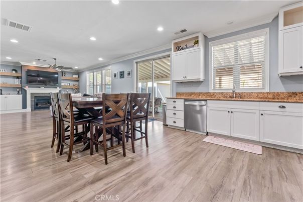 Dining room, Fireplace, Interior, Kitchen, Recessed Lighting, Wood Texture Flooring