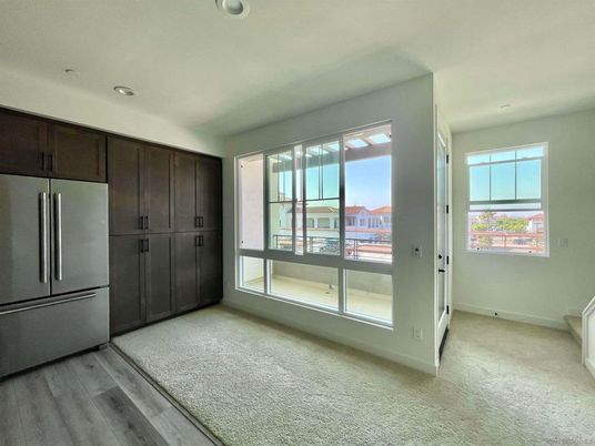 Empty room, Interior, Kitchen, Recessed Lighting, Stainless Steel Appliances, Wood Texture Flooring