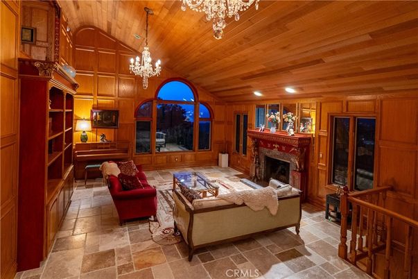 Chandelier, Fireplace, Interior, Living room, Recessed Lighting, Wooden Ceilings, Wooden Walls