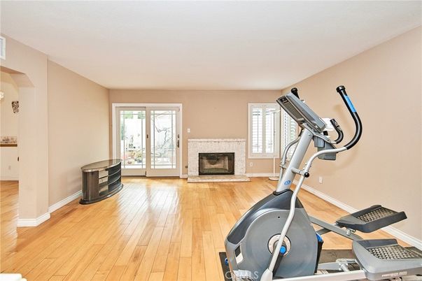 Fireplace, Fitness Equipment, Interior, Wood Texture Flooring