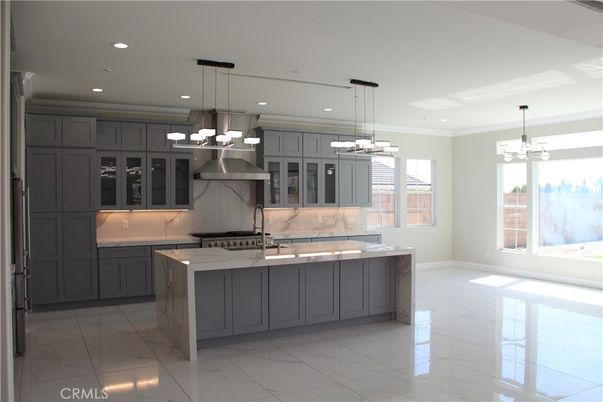 Chandelier, Interior, Kitchen, Marble, Marble Walls, Pendant Lights, Recessed Lighting, Stainless Steel Appliances