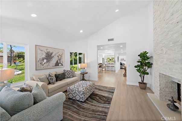 Fireplace, Interior, Living room, Recessed Lighting, Stone Walls, Wood Texture Flooring