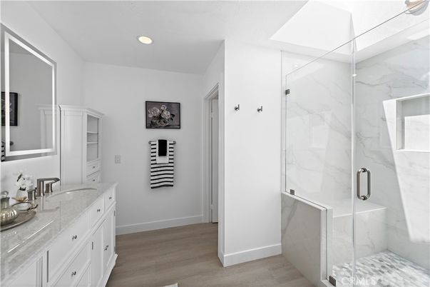 Bathroom, Glass Shower, Interior, Marble Walls, Recessed Lighting, Wood Texture Flooring
