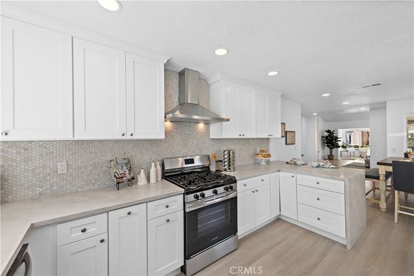 Dining room, Interior, Kitchen, Recessed Lighting, Stainless Steel Appliances, Wood Texture Flooring